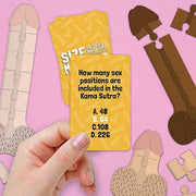 Size Matters adult trivia game card held against pink illustrated background