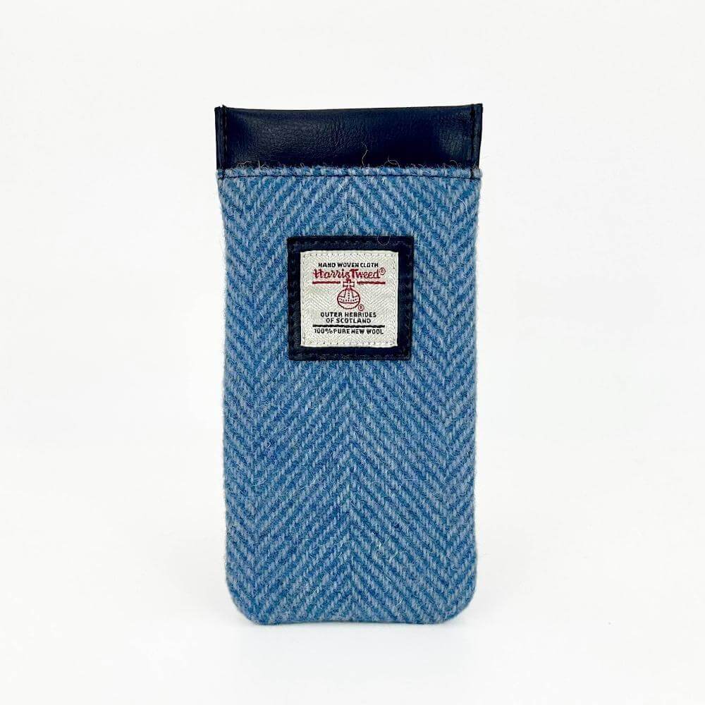 Sky blue Harris Tweed glasses pouch with black trim and front label, displayed upright.
