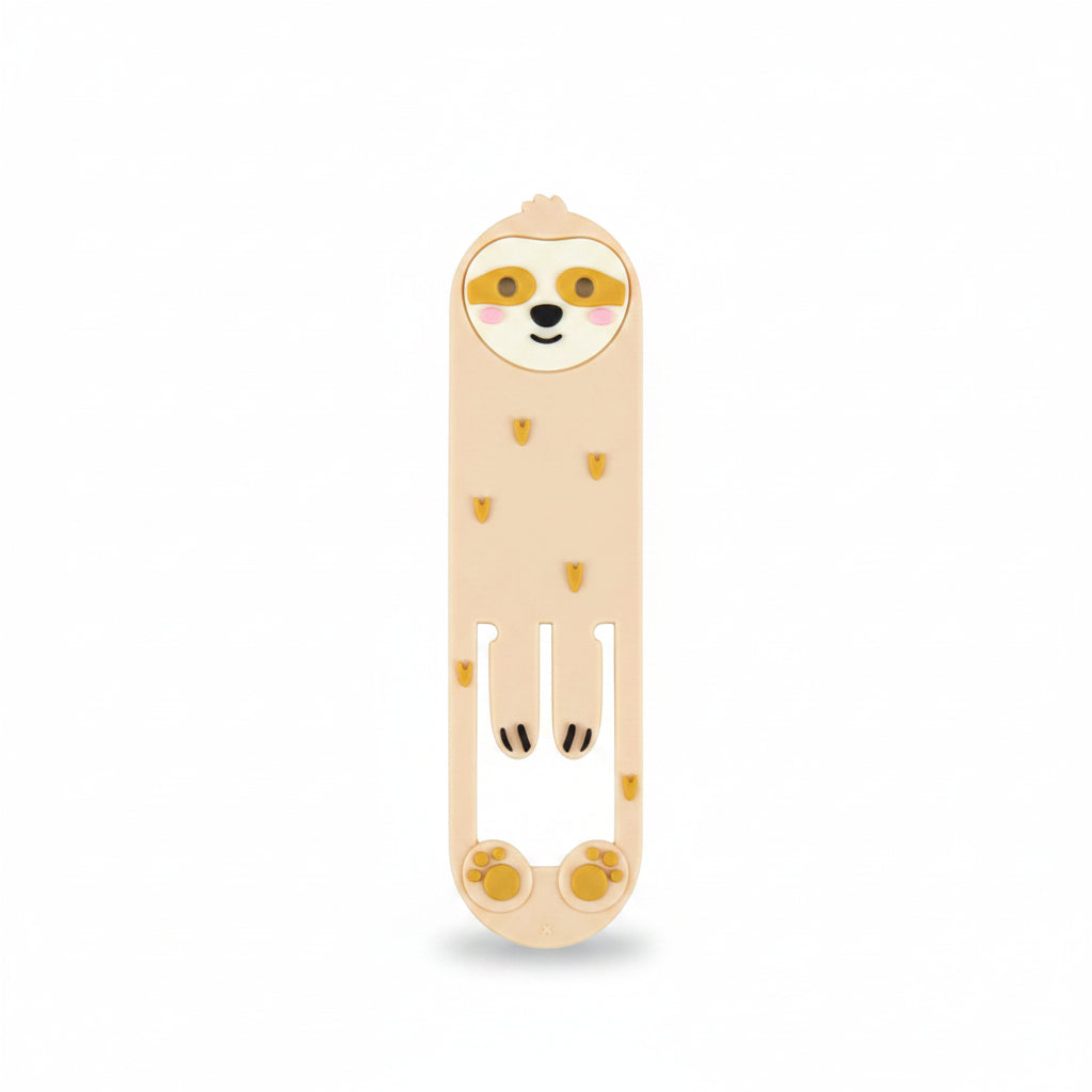 Sloth Reading Light clipped onto an open book – used as a bookmark with visible page detail.