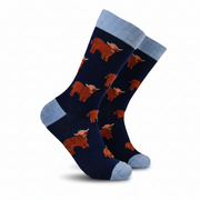 Fluffy Coo Socks pair showing highland cow design on light grey background