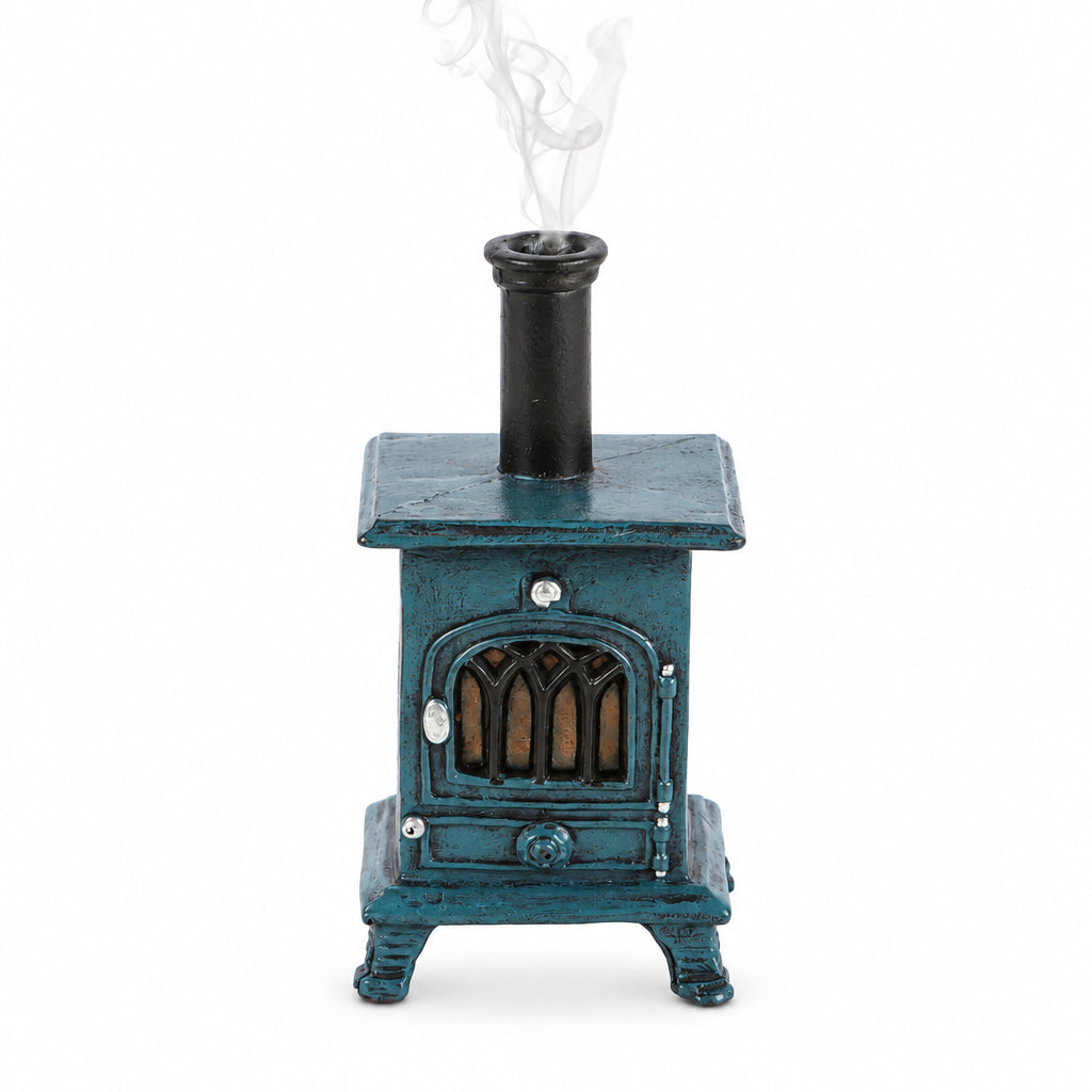 Front view of stove-shaped incense burner with smoke – rustic blue incense cone holder styled like a vintage wood burner.
