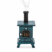 Front view of stove-shaped incense burner with smoke – rustic blue incense cone holder styled like a vintage wood burner.
