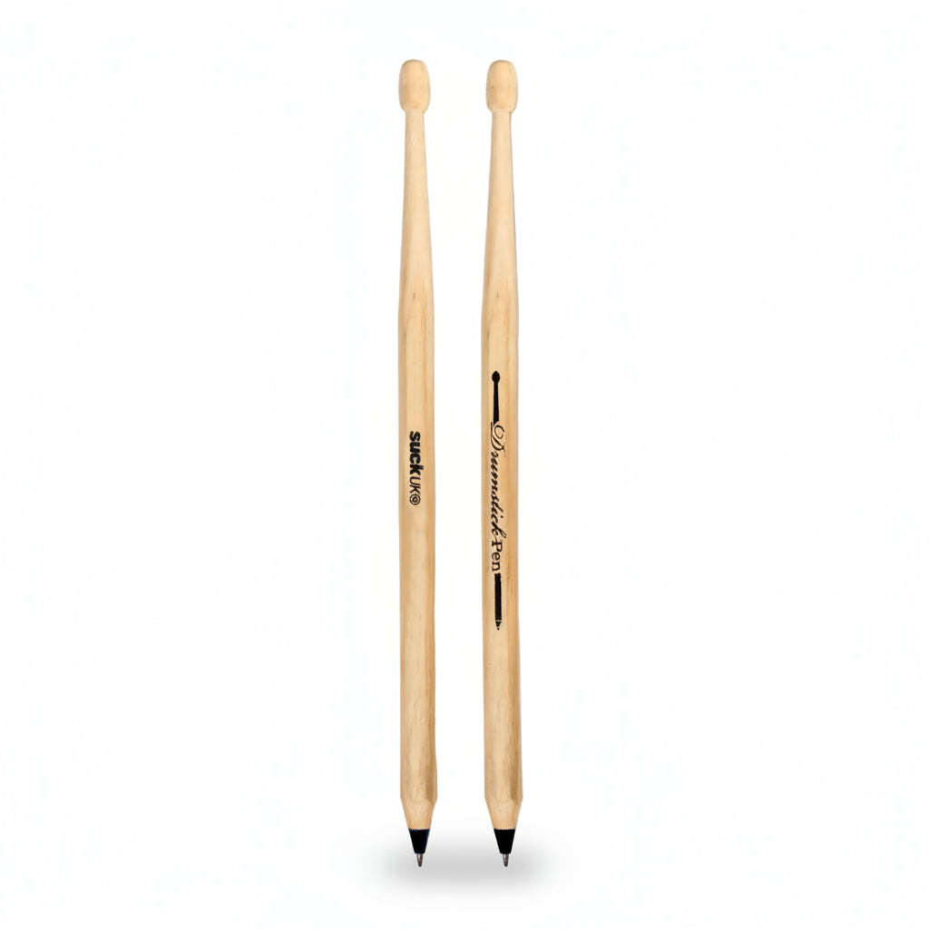 Overhead view of two drumstick pens placed side by side on a neutral background, showing both SUCK UK and Drumstick Pen branding.