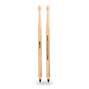 Overhead view of two drumstick pens placed side by side on a neutral background, showing both SUCK UK and Drumstick Pen branding.