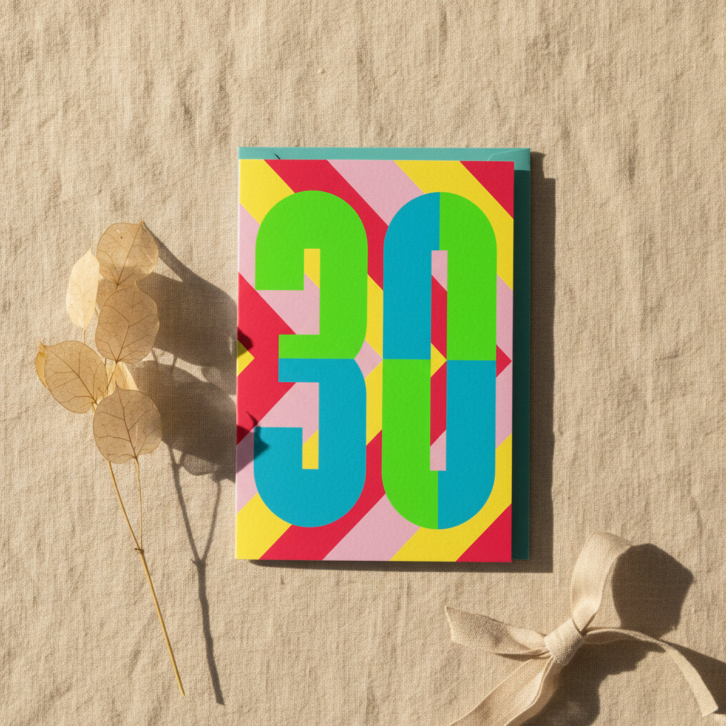 Colorful card with the number '30' on a geometric patterned background