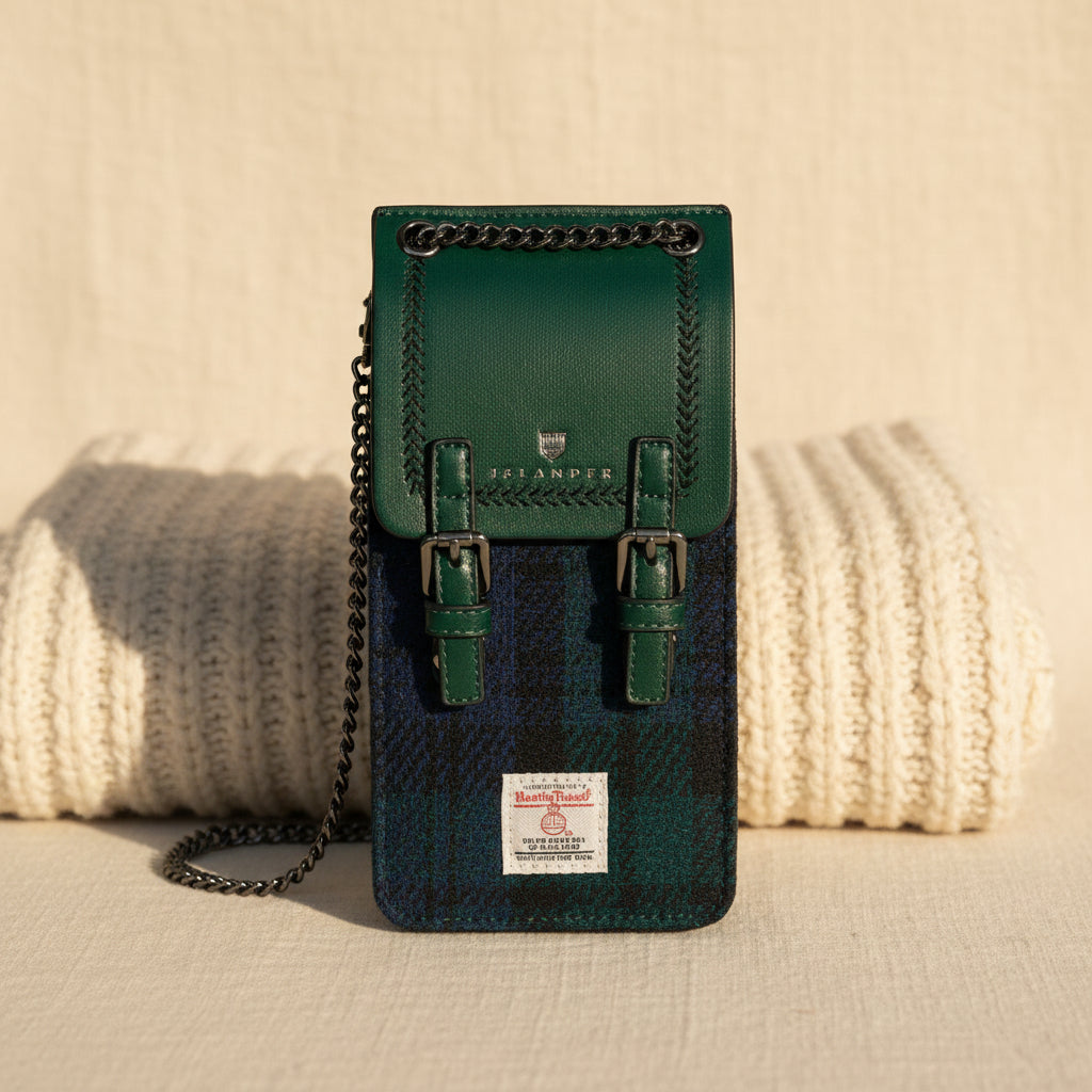 Green leather phone pouch with chain strap on a white background