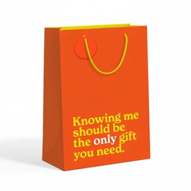 Orange medium gift bag with yellow text on white background