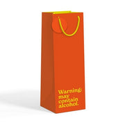 Burnt orange bottle gift bag with yellow text on white background