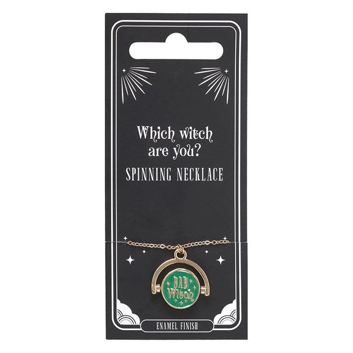 Spinning witch mood necklace worn on black top.