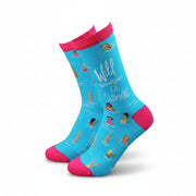 Bright turquoise women’s bamboo socks with pink accents, featuring swimmers and the text “Wild Women Go Swimming” – fun sustainable sock design.