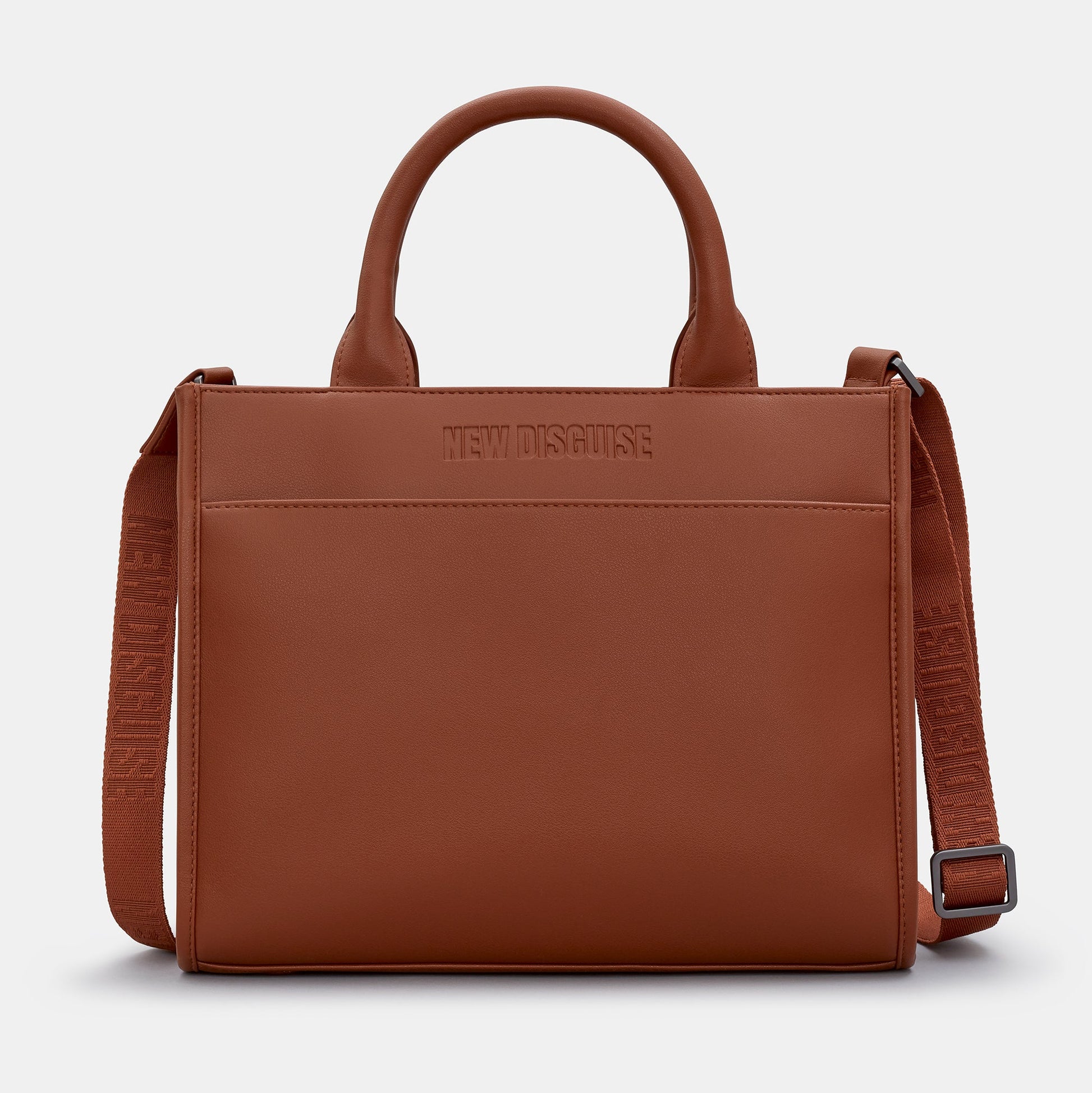 Brown leather handbag with shoulder strap on a light gray background