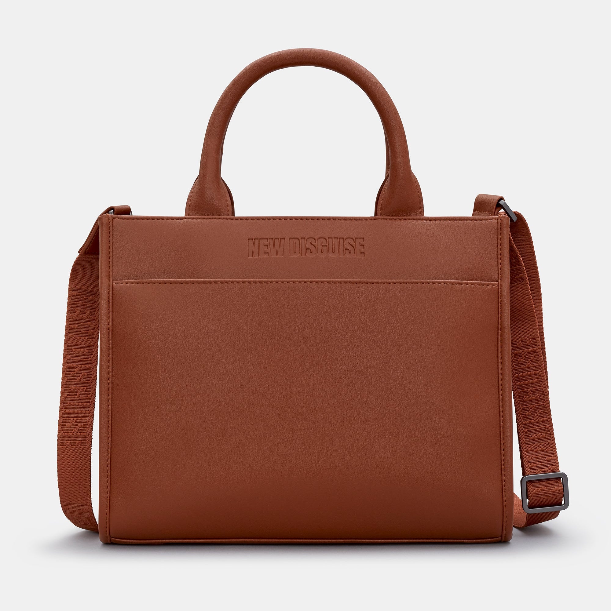 Brown leather handbag with shoulder strap on a light gray background