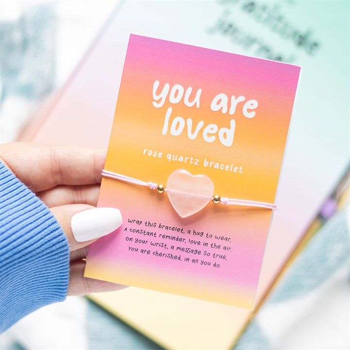 You Are Loved pink rose quartz heart bracelet on a branded card with affirmation text, perfect for gifting.
