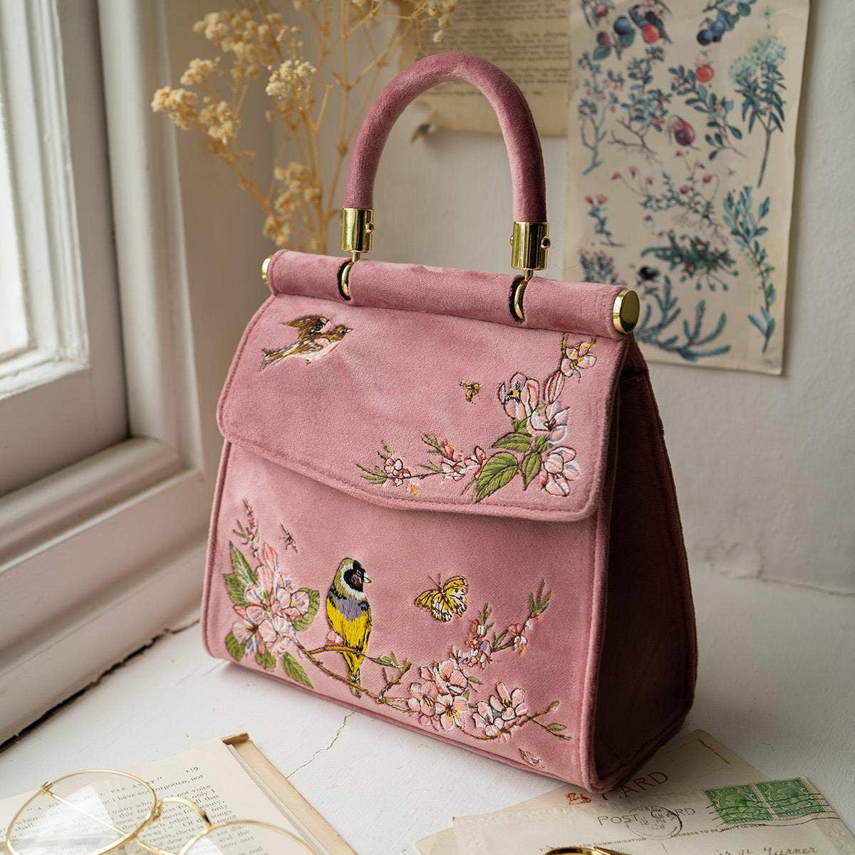 Pink Morning Song Bird embroidered tote on windowsill with floral wallpaper