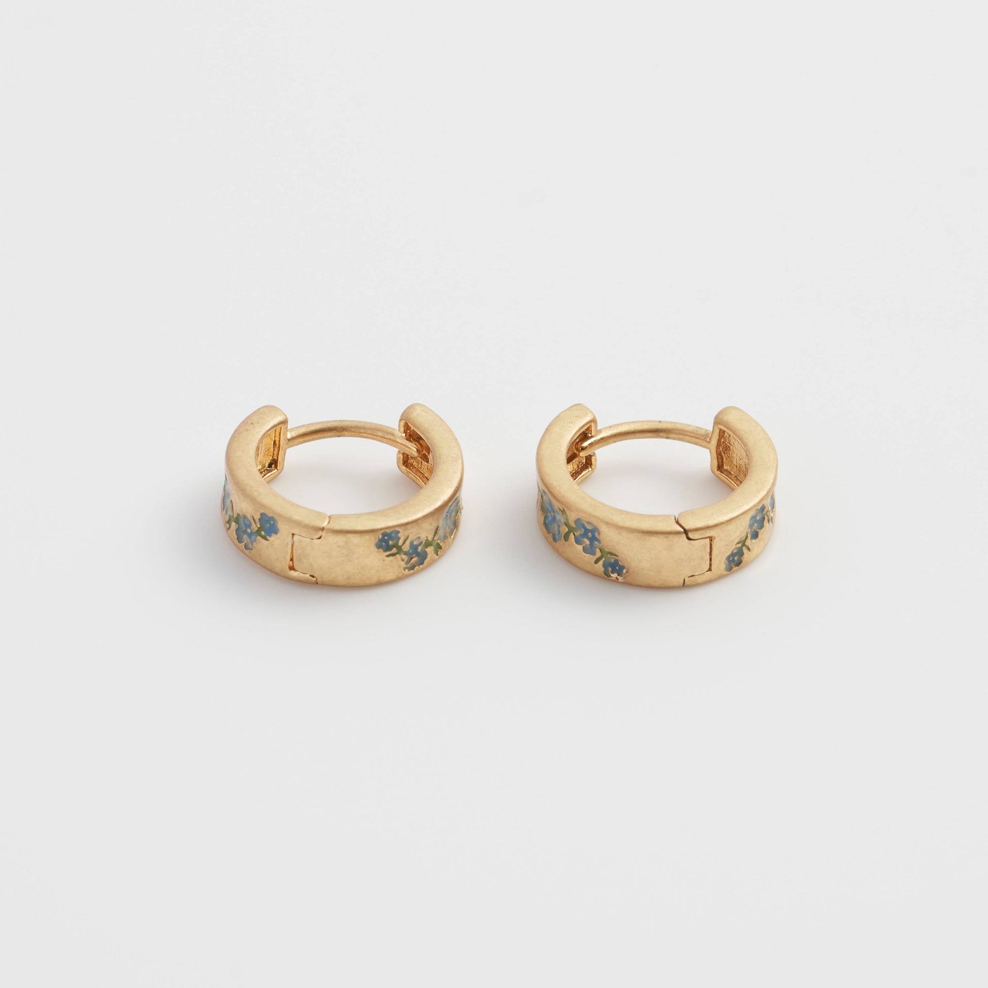 Fable forget-me-not hoop earrings pair, front view standing upright