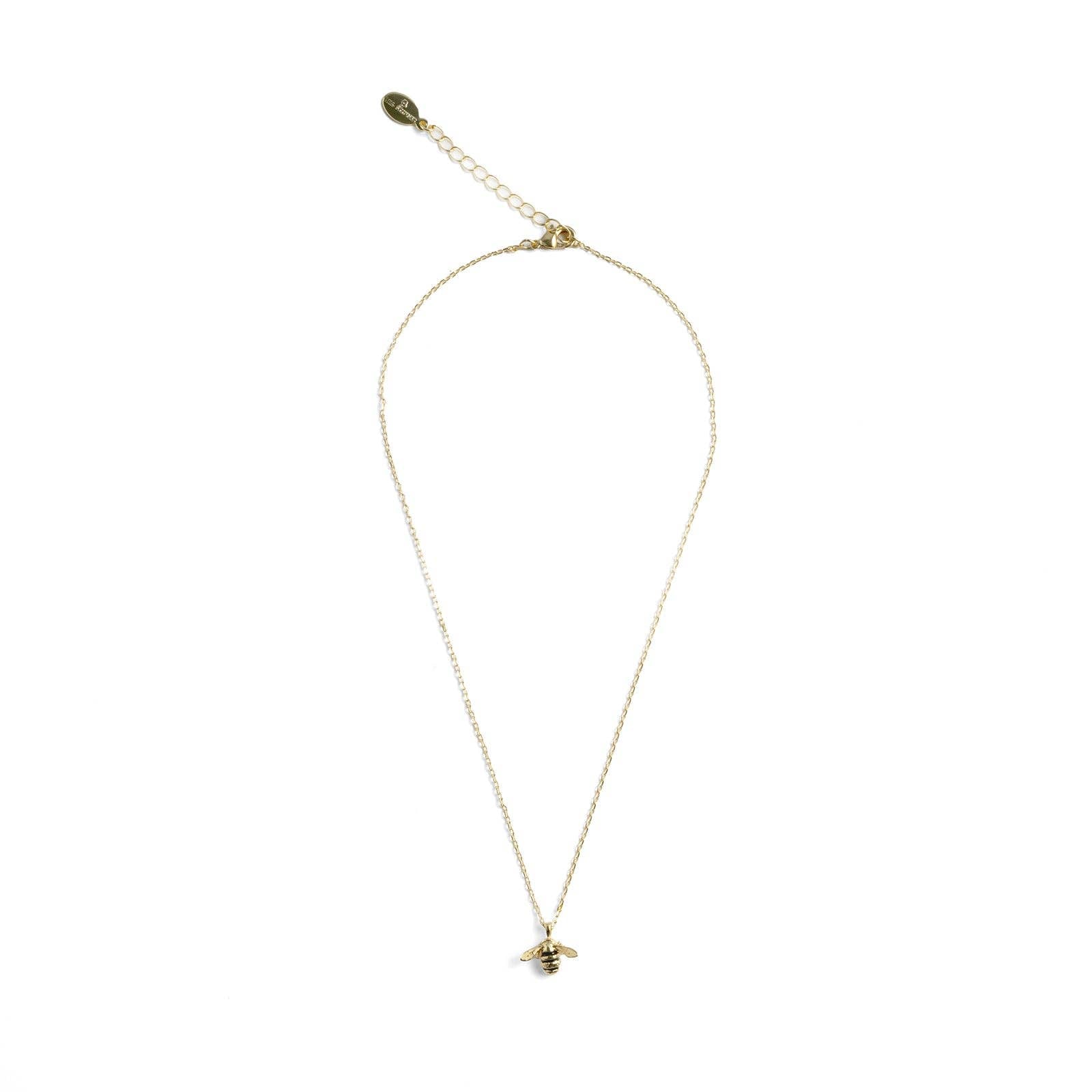 Bee pendant on presentation showing Bill Skinner branding