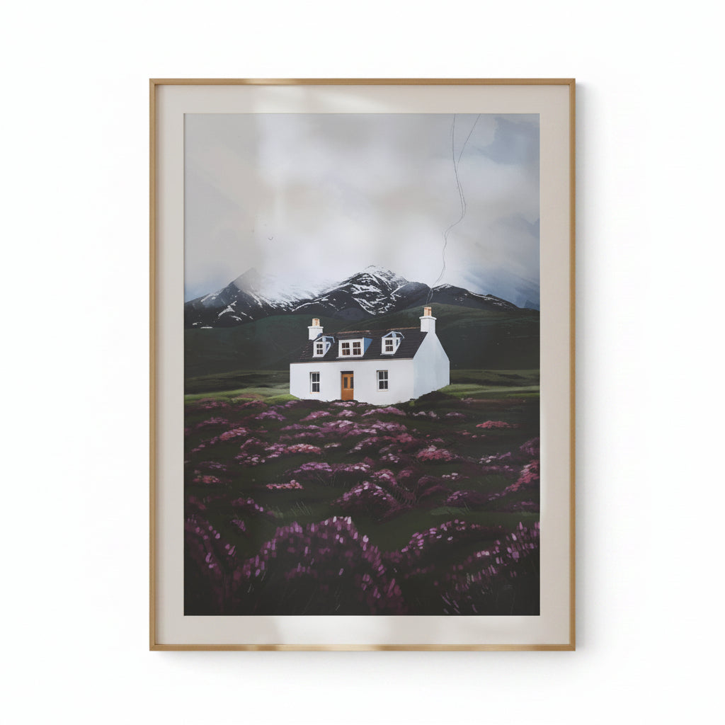 Framed artwork of a house in a field with mountains on a beige wall