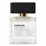 Parisian eau de parfum bottle with black cap, front view on cream background