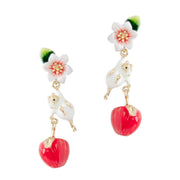 Apple Blossom & Mouse Drop Earrings by Bill Skinner featuring enamel mouse and red apple charm on white background.