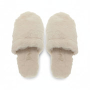 Pair of cream faux fur open toe mule slippers viewed from above on white