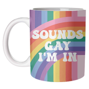 Sounds Gay I'm In mug with wraparound rainbow stripes on a white background
