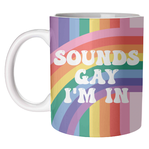 Sounds Gay I'm In mug with wraparound rainbow stripes on a white background