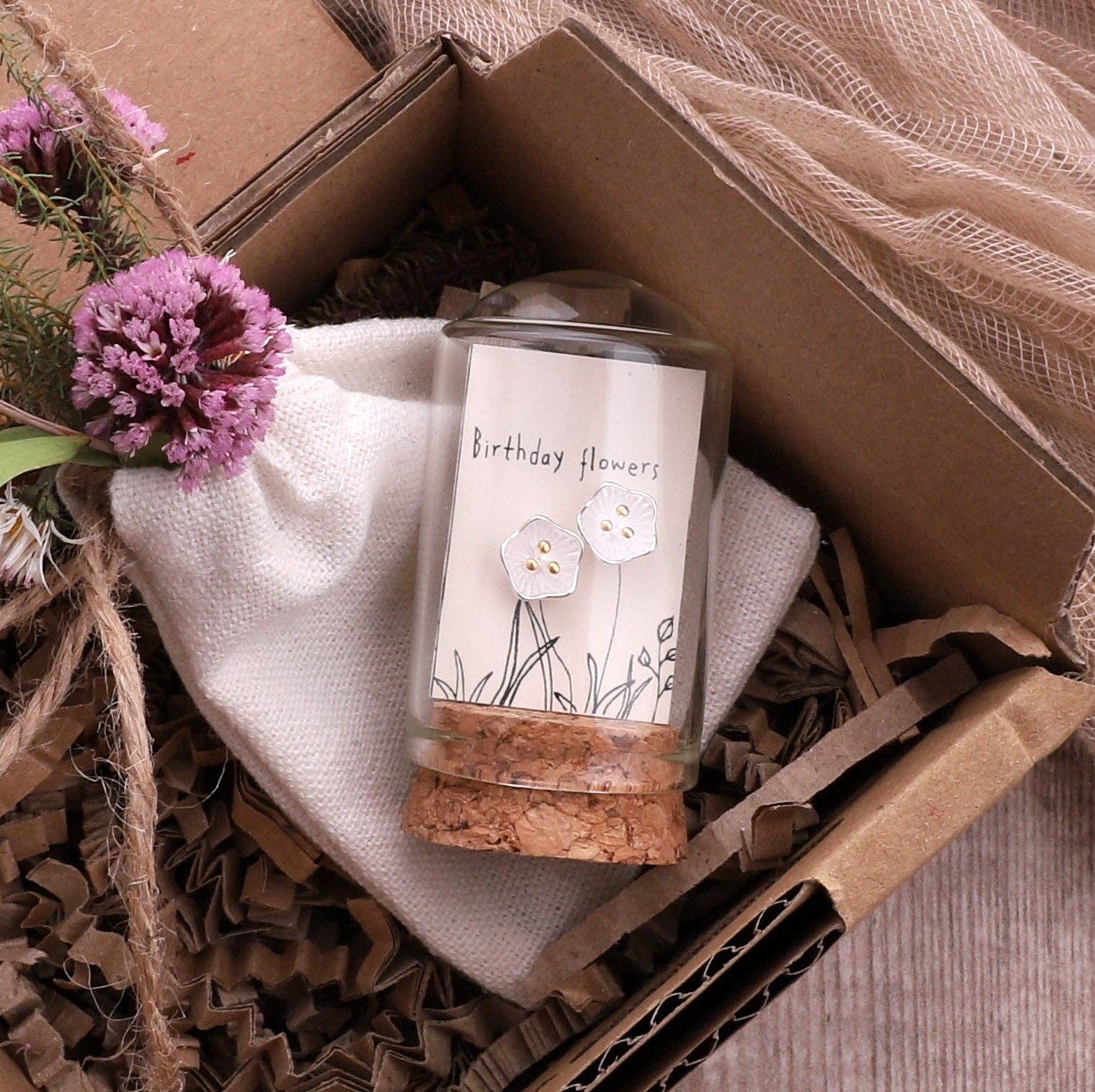 Glass terrarium earring gift in brown kraft box with tissue paper and dried flowers