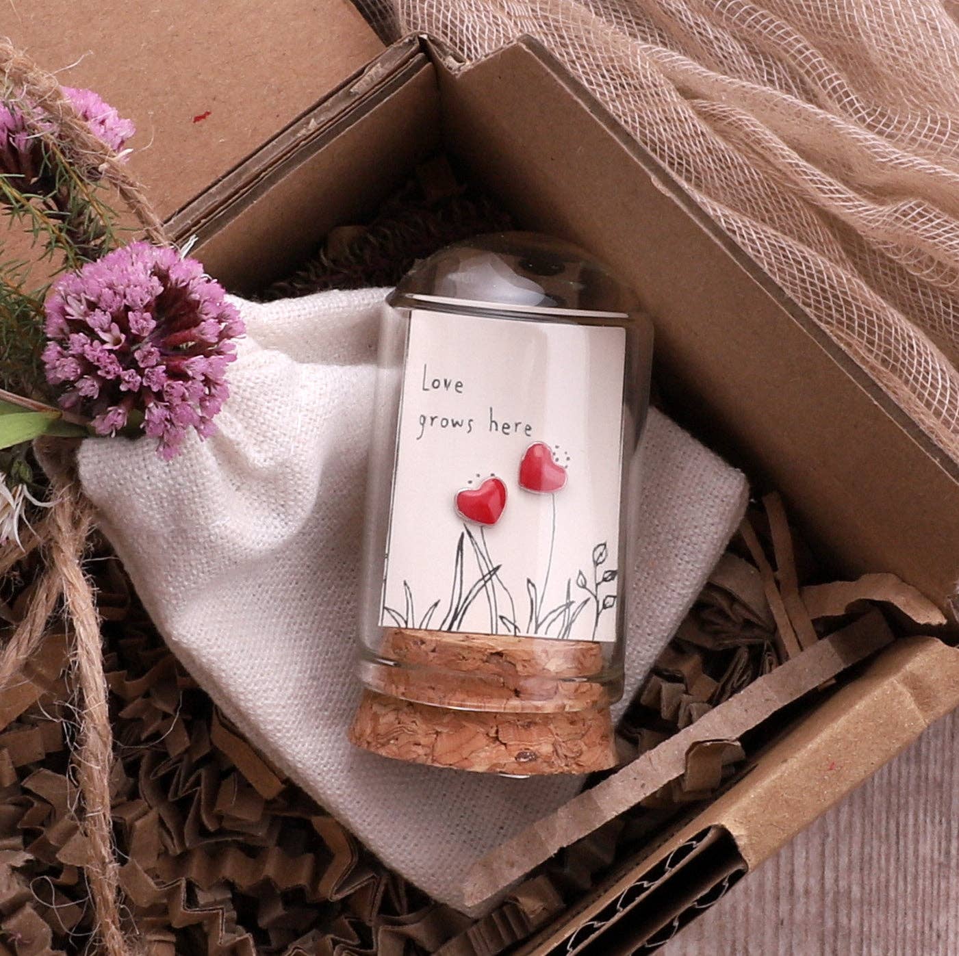 Glass terrarium earring gift in kraft box with dried flowers and tissue paper