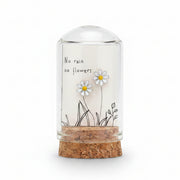 Silver enamel daisy earrings on message card inside glass terrarium held in hand