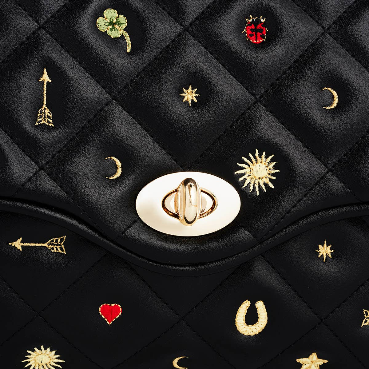 Black Quilted Motif Embroidered Crossbody showing detachable cream shoulder strap