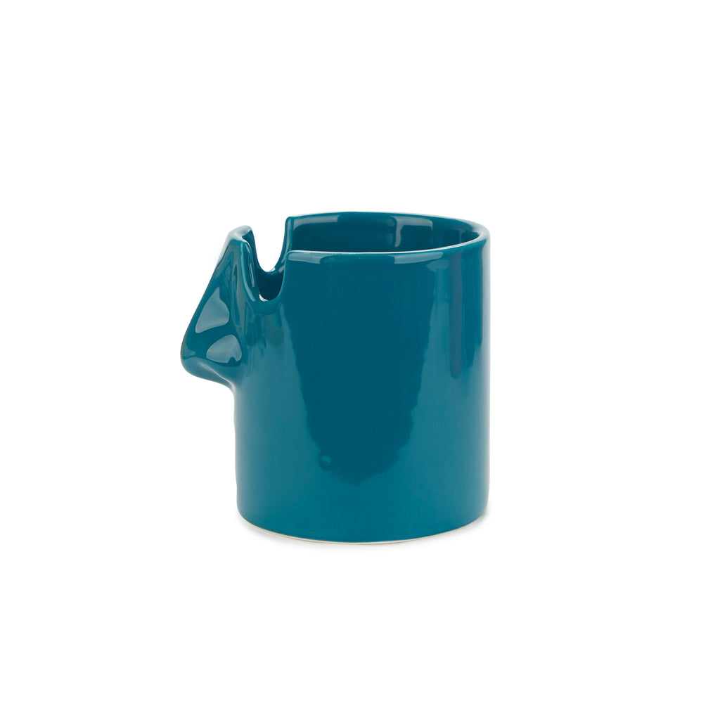 Side profile of the teal blue nose-shaped glazed ceramic pen pot