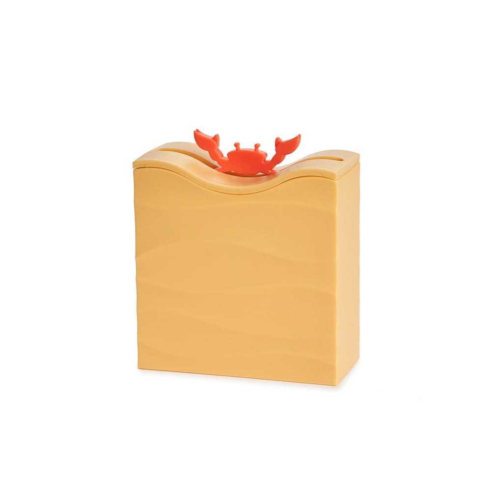 Sand-coloured crab toothpick dispenser with red crab on a white background