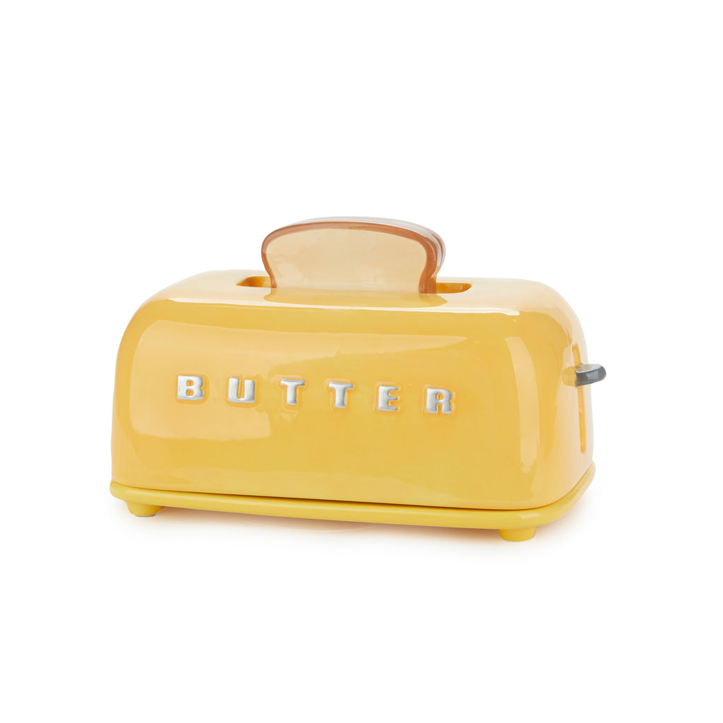 Angled view of the mustard toaster butter dish showing the toast slice handle