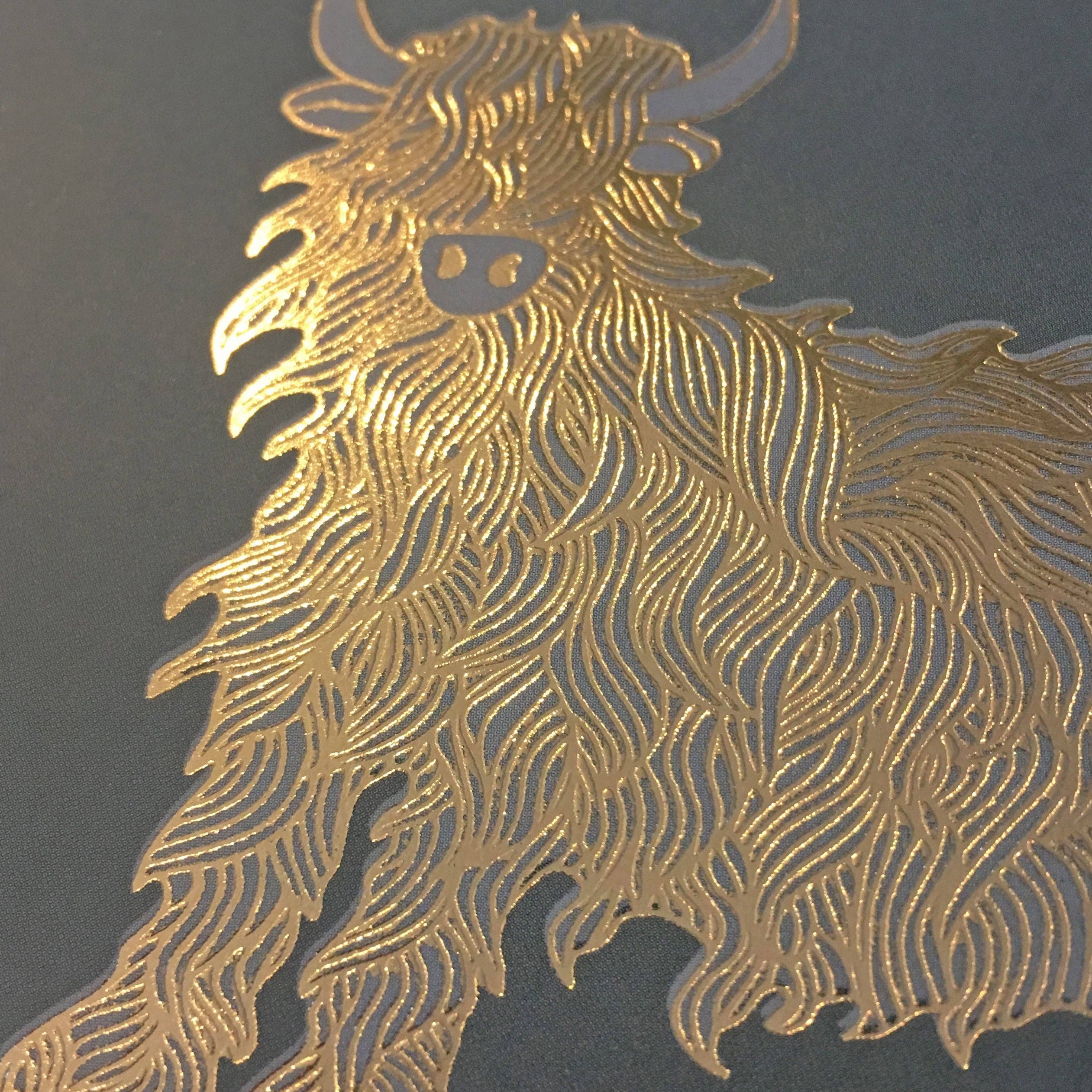Close up of the gold foil Highland cow showing the shaggy coat detail