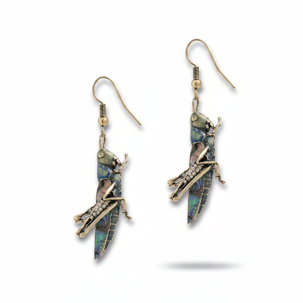 Green resin grasshopper drop earrings with crystal accents and gold fish hook fastening on white background