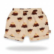Cream highland cow cotton shorts flat lay on neutral background