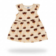 Cream highland cow dress flat lay on neutral background