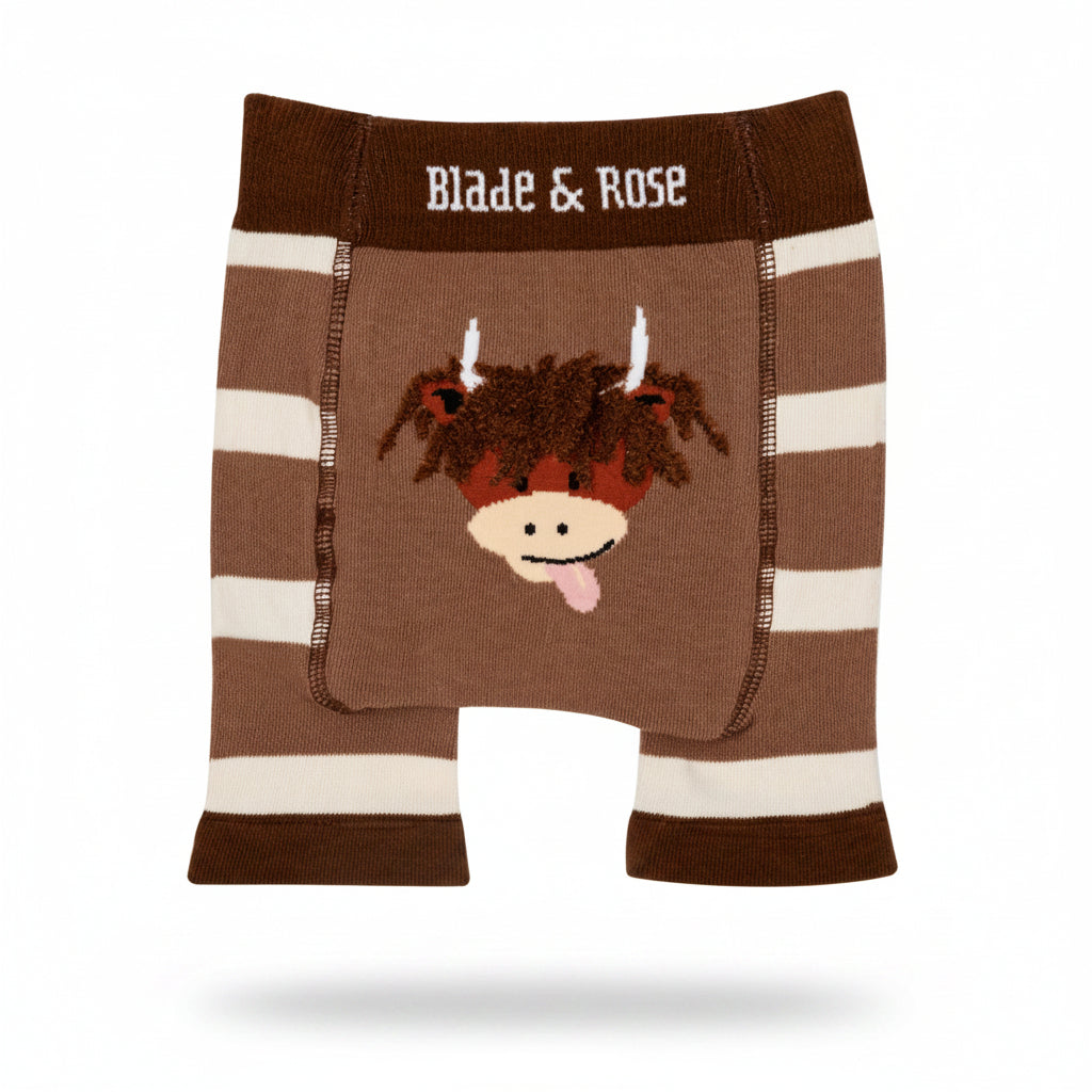 Brown highland cow knitted shorts flat lay on neutral background