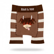 Brown highland cow knitted shorts flat lay on neutral background