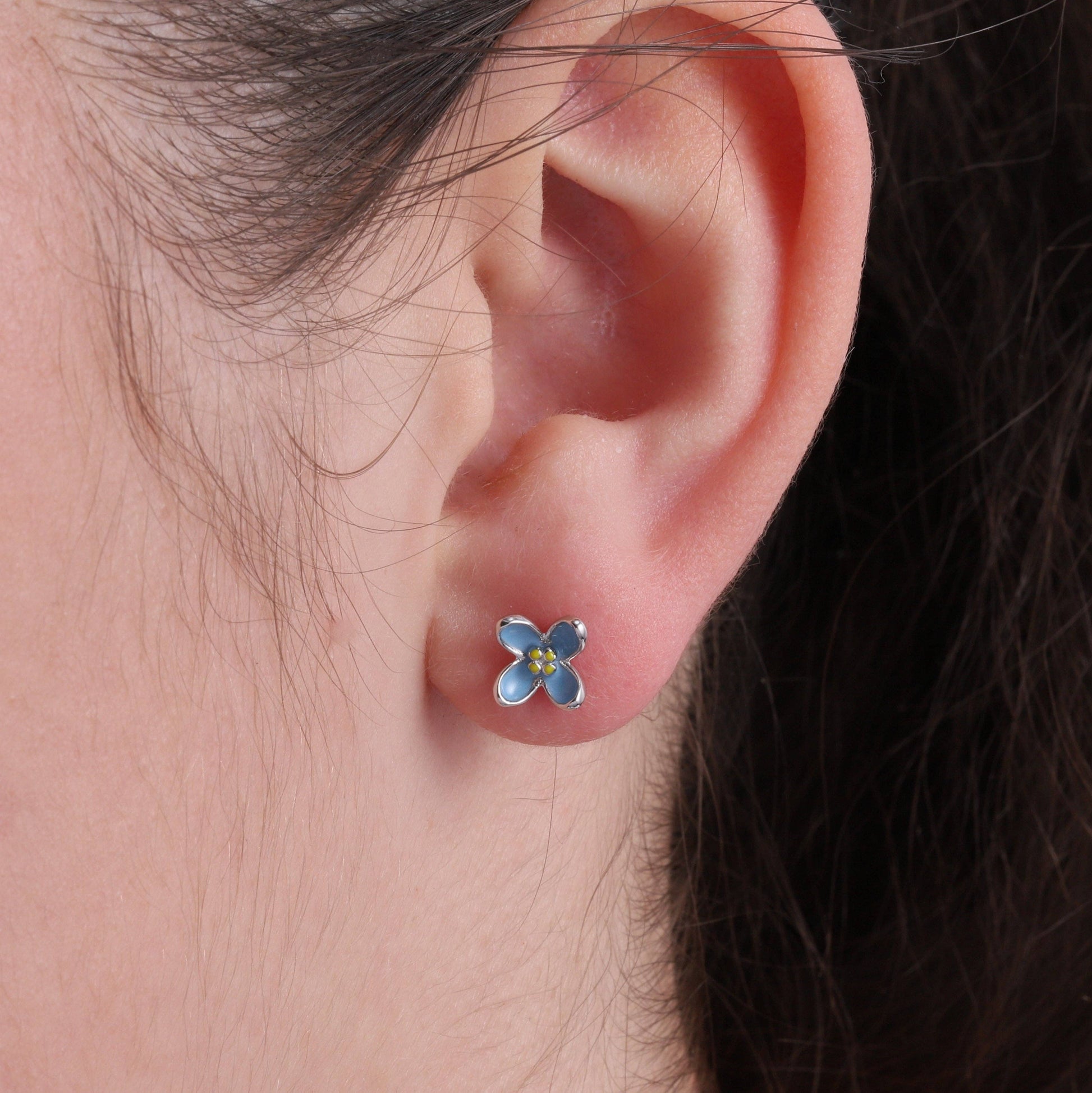 Blue enamel flower earrings, close-up detail