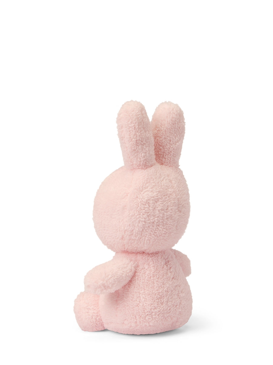 Back view of the 23cm light pink Miffy Terry soft toy showing the tail