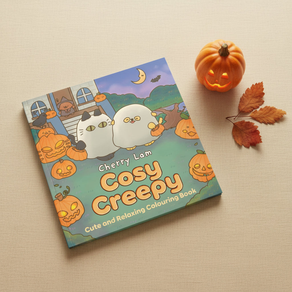 Cosy Creepy cover showing cats and pumpkins in a Halloween garden