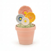 Close up of ceramic flower measuring spoons with detailed petal designs