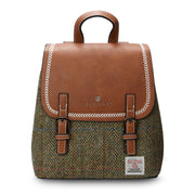 Chestnut herringbone Harris Tweed Mini Jura backpack with brown leather flap on white background.