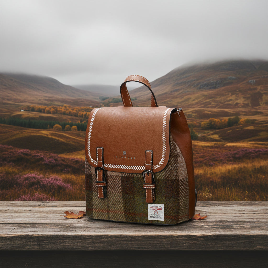 Angled view of Chestnut Tartan Harris Tweed Mini Jura backpack with buckle detail.