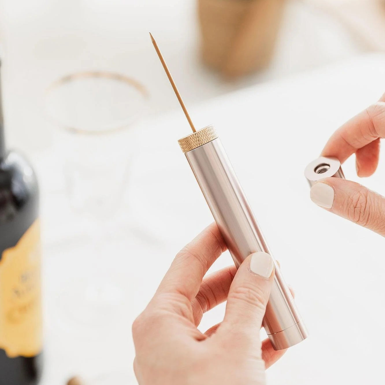 Air pump wine cork opener assembled on table