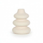 Close-up of cream ceramic vase showing speckled texture and matte finish