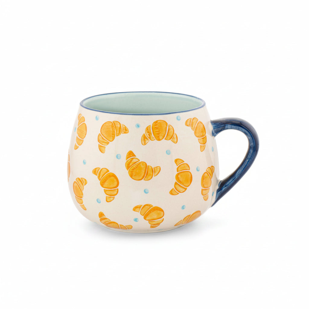 Mug with croissant pattern on a white background