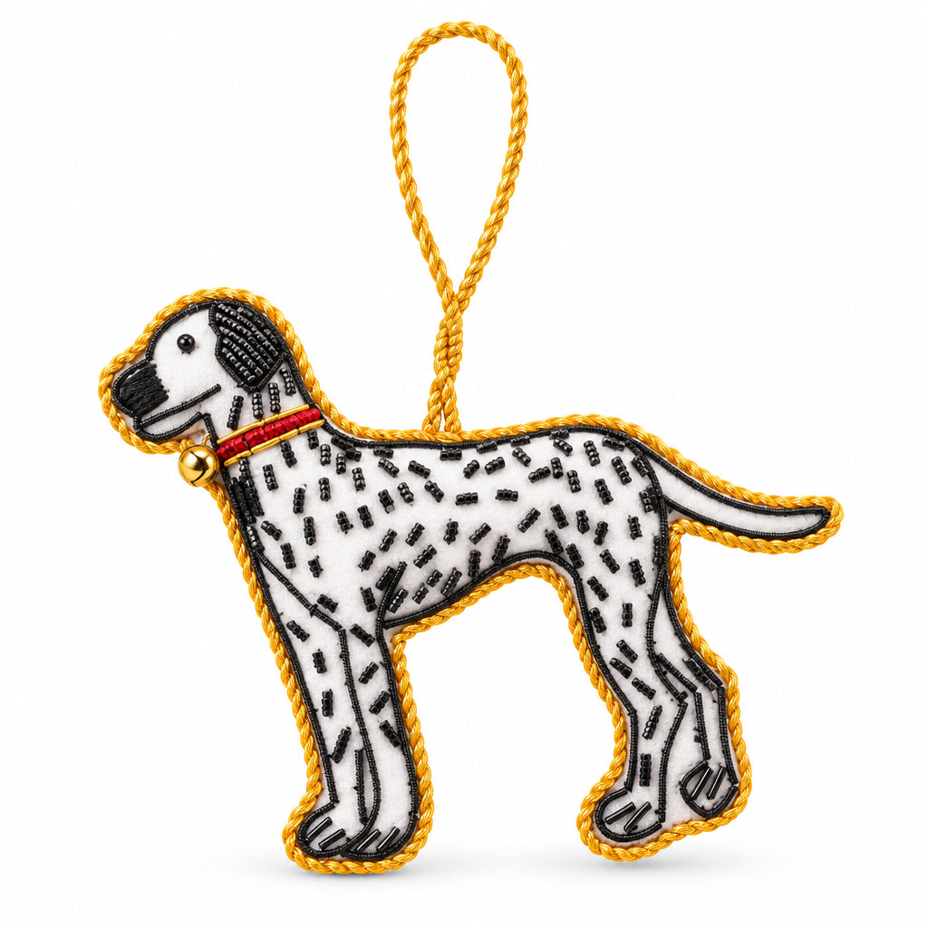Dalmatian embroidered decoration close up, showing the spots, red collar and bead eye