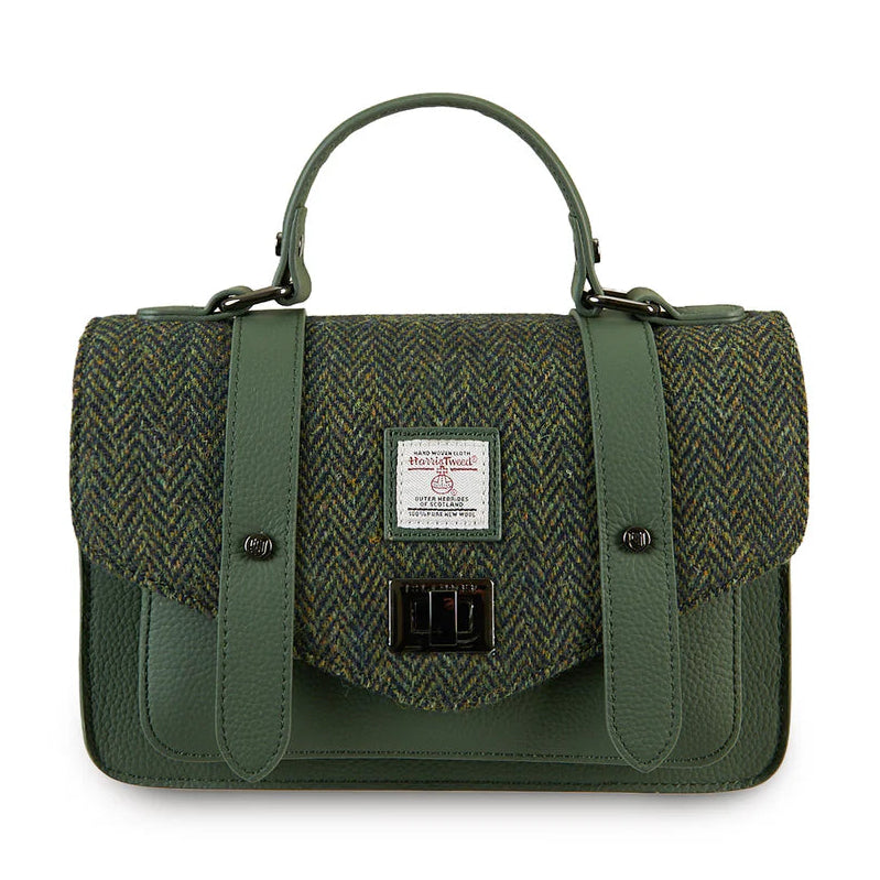 Dark green herringbone Harris Tweed medium leather satchel front view with top handle.
